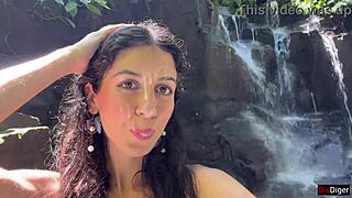 she gets cum on her face in the public locker room, then walks to the waterfall covered in it.