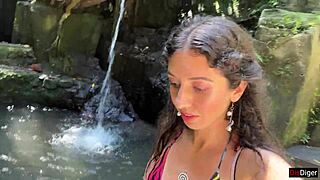 she gets cum on her face in the public locker room, then walks to the waterfall covered in it.