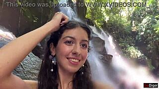 she gets cum on her face in the public locker room, then walks to the waterfall covered in it.