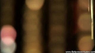 The mature Indian brunette stands confidently in her stylish black dress.