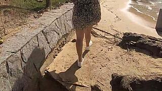 young girl flashes pussy on beach in public