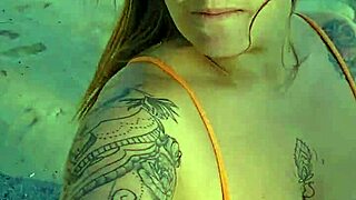 Girl flashes tits to buy items on beach.