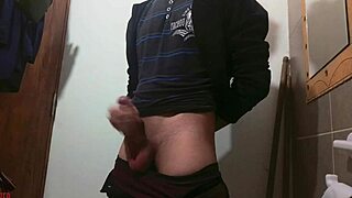 a skinny young girl plays with her monster cock in the bathroom