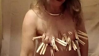 French slave's intriguing self-bondage with clamps and belt in outdoor humiliation