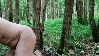 bondage slave performs masturbation in outdoor forest with toys