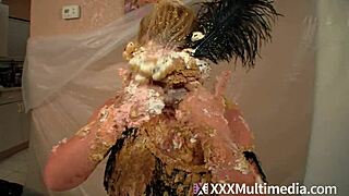 two blondes get soaking wet and messy with cream pies on their faces.