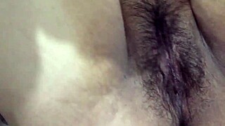 Asian babe masturbates after work.