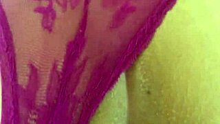 the sexy latina with big ass and natural tits poses on all fours in a thong