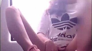 Cute girl enjoys lollipop on train