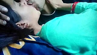 kissing and pressing girlfriend's big boobs