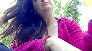 nicoletta lights up in the garden, flashing her big tits