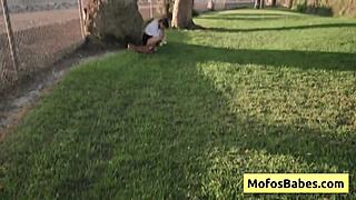 this sexy asian teen is revealing her big natural boobs to her friend outdoors.