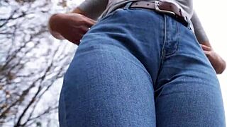 look at this milf teasing her big cameltoe in tight blue jeans outdoors, wanna see more?