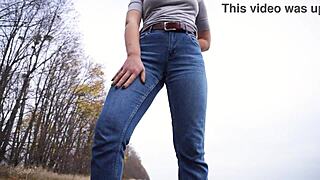 look at this milf teasing her big cameltoe in tight blue jeans outdoors, wanna see more?