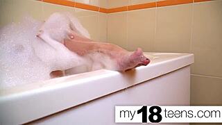 Babe masturbates in bath to close-up orgasm