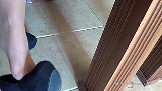 In the office, she dangles her heels and teases with feet and pantyhose