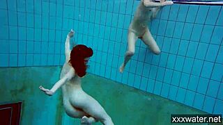 Russian girls in bikinis swimming and playing underwater in the pool