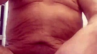 Chris performs cam show in shower bathing