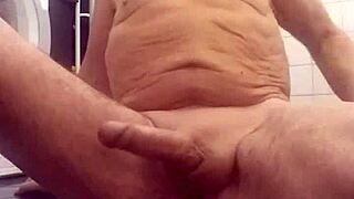 Chris performs cam show in shower bathing