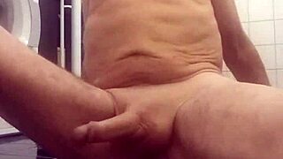 Chris performs cam show in shower bathing