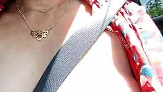 Riding down the road flashing bare tits