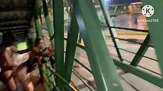 The wife indulges two men on the Via Dutra walkway.