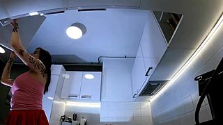 Why is the hottest redhead tattooed cheerleader flashing her see-through panties in the kitchen with those over-knee socks?