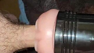 guy strokes big cock in fleshlight during voyeur session