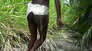 skinny african tribe woman works outdoor in the sun.