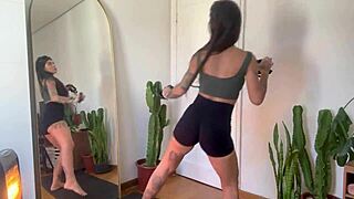 Inked girl does rubber band workout warm-up for strength and yoga fitness