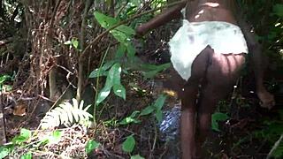 skinny african tribe woman works outdoor in the sun.