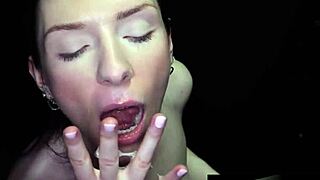 hot brunette deepthroating cocks at the gloryhole, sucking sloppy with natural tits.