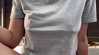 The italian milf with big tits smokes outdoors