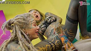 Tattooed lesbians with split tongues feel intense anal pleasure during toy play.