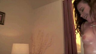 The curvy brunette coed rides the big cock passionately, deepthroating hard on the bed.