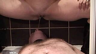 i tortures the slaves nipples with clamps and waxs, then piss on the sow.