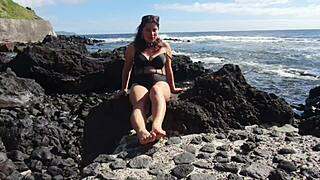 Seductive stepmom indulges in foot fetish on public beach. 😏