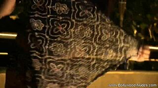 The beautiful brunette goddess from India dances and teases in a softcore striptease.