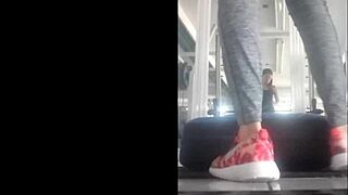 slim mexican teen in leggings bent over in gym