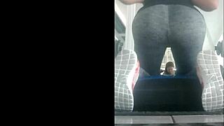 slim mexican teen in leggings bent over in gym