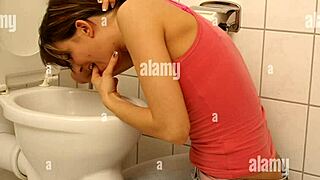 puking girl fingers sloppy pussy in bathroom