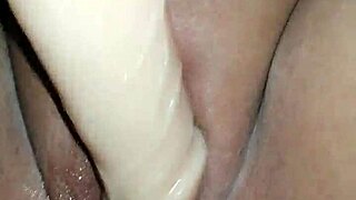 Amateur babe spreads legs wide, slams huge dildo deep into wet pussy, masturbating to squirting orgasm.