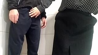 gorgeous mature milf with curvy belly grips cock firmly in public toilet for explosive handjob finish