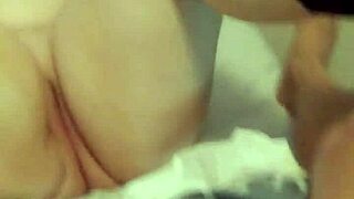 Chubby fetish dude strokes fat cock in socks.