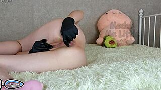 stepsis pisses in latex gloves with buttplug masturbating her huge clit