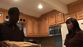 Black milf mommy in fishnets slurps enormous cock before doggystyle assfucking on bed