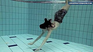Russian Teen Flashes Massive Tits Underwater at Beach Pool Making Viewers Horny