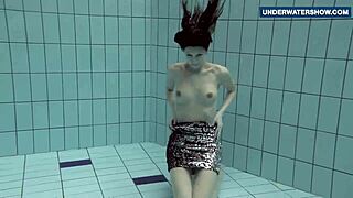 Russian Teen Flashes Massive Tits Underwater at Beach Pool Making Viewers Horny