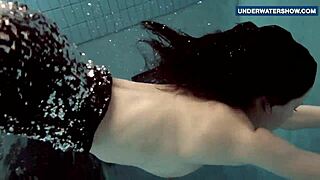Russian Teen Flashes Massive Tits Underwater at Beach Pool Making Viewers Horny