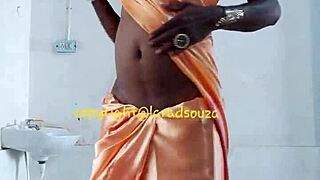 lara dsouza rocks orange satin saree as indian crossdresser slut